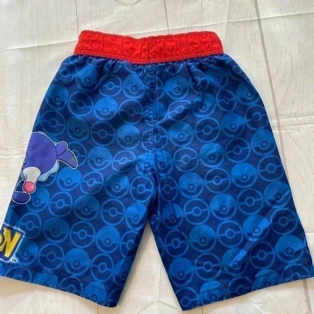 Boys Pokémon branded swim trunks.‎ Size M